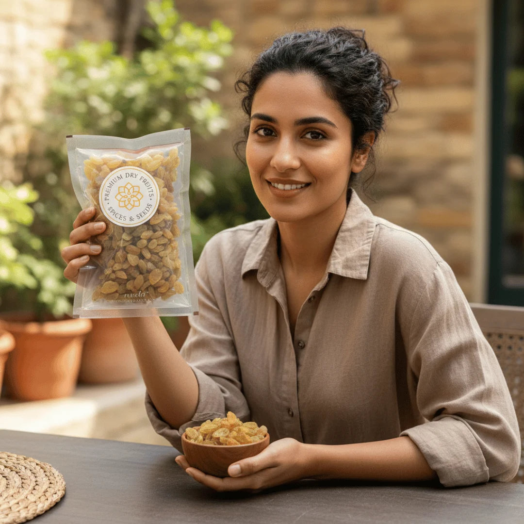 Woman holding a package of Round Raisins Premium and a bowl of dried fruits outdoors