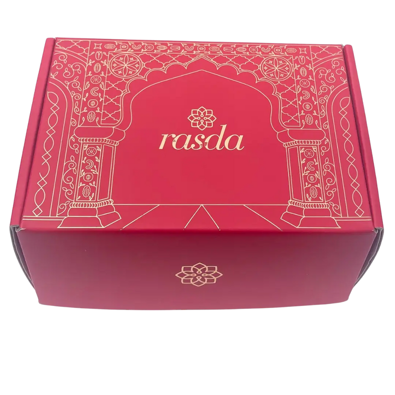 Red decorative box with 'rasda' branding on a white background - Rudira Dry fruits Gift Box Premium with Tins inside.