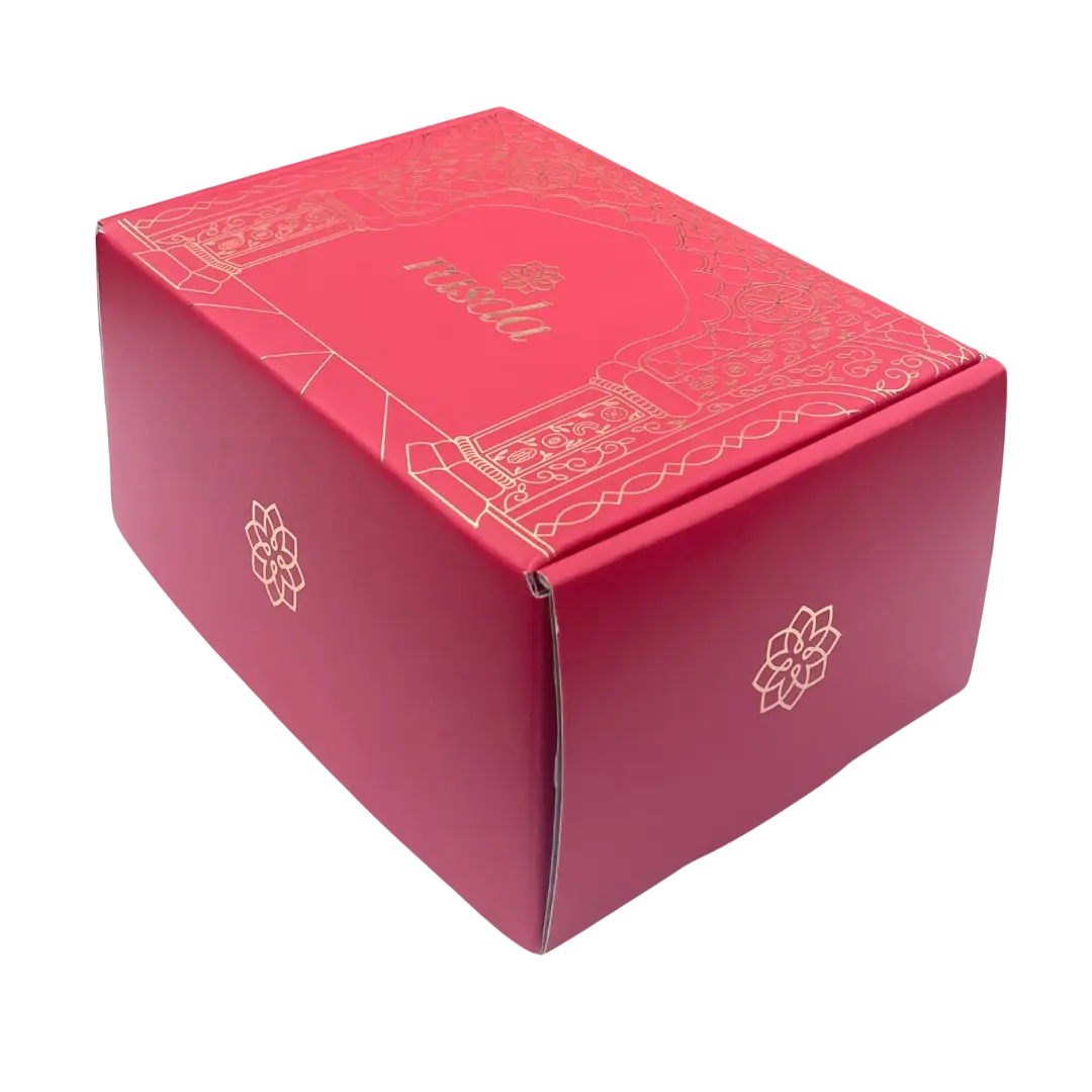 Red box with gold accents and a brand logo on a white background - Rudira Dry fruits Gift Box Premium with Tins inside.