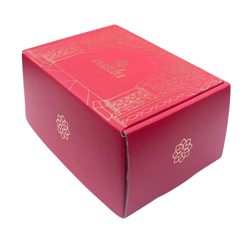 Red box with gold accents and a brand logo on a white background - Rudira Dry fruits Gift Box Premium with Tins inside.