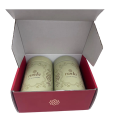 Two green containers with a brand logo in a red box on a white background- Rudira Dry fruits Gift Box Premium with Tins inside.