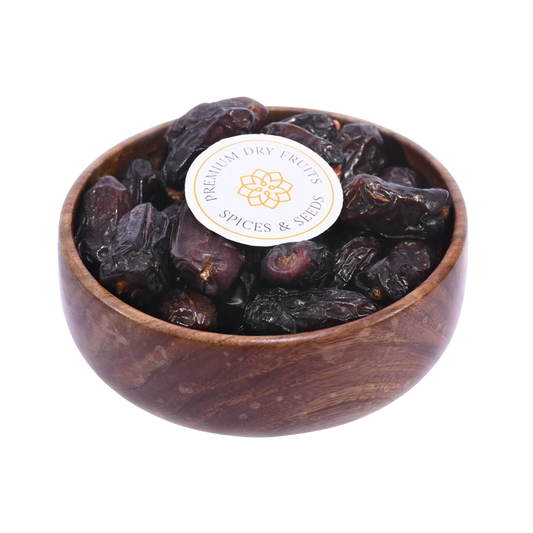 Safawi Dates Saudi Arabia Select in wooden bowl soft dark dates rich in fiber and natural energy