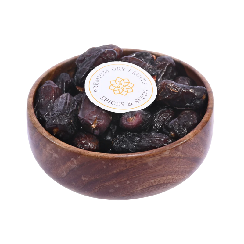 Safawi Dates Saudi Arabia Select in wooden bowl soft dark dates rich in fiber and natural energy