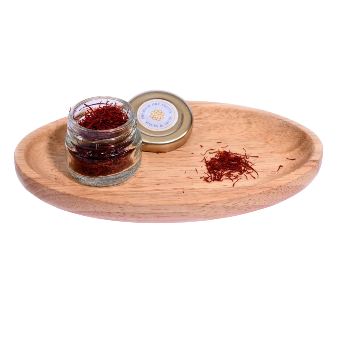 Jar of saffron on a wooden tray with a white background