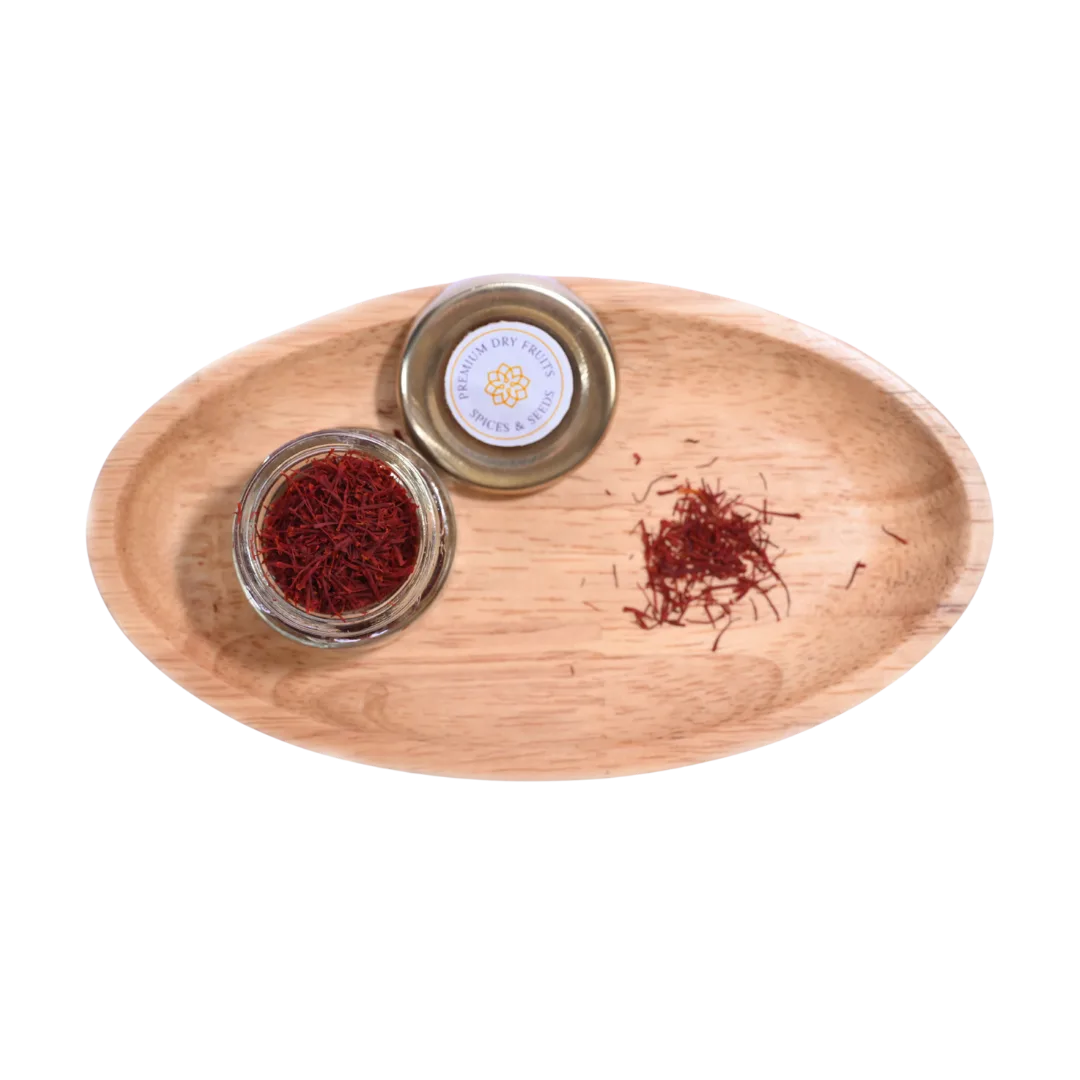 Wooden tray with saffron and a small container on a white background