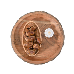 Sagai dates are typically medium-sized, oblong-shaped, and have a dark brown skin with a light-colored flesh inside.