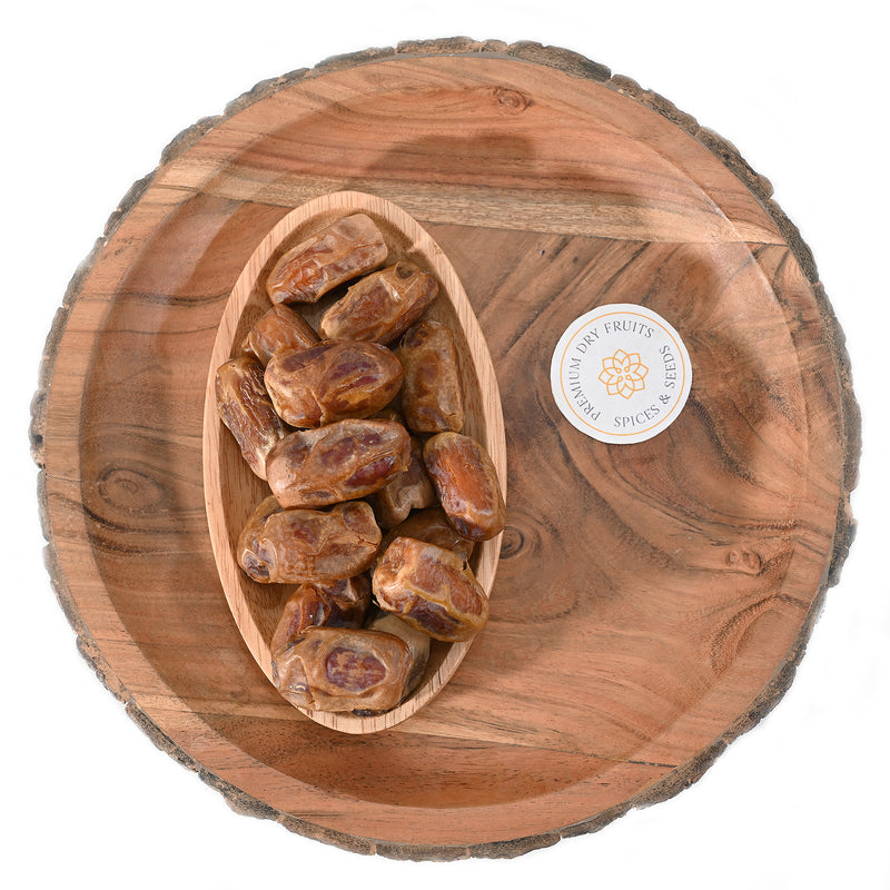 Sagai dates are typically medium-sized, oblong-shaped, and have a dark brown skin with a light-colored flesh inside.