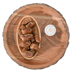 Sagai dates are typically medium-sized, oblong-shaped, and have a dark brown skin with a light-colored flesh inside.