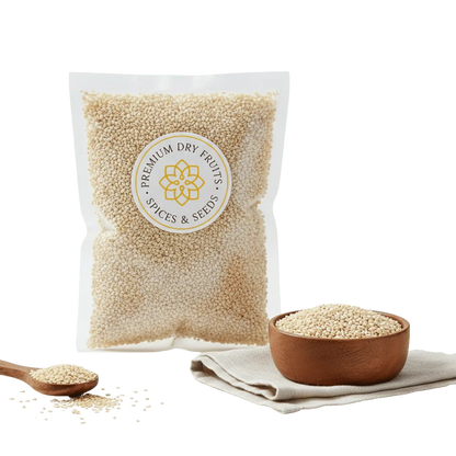 Bag of premium Sesame seeds white with a bowl and spoon on a white background