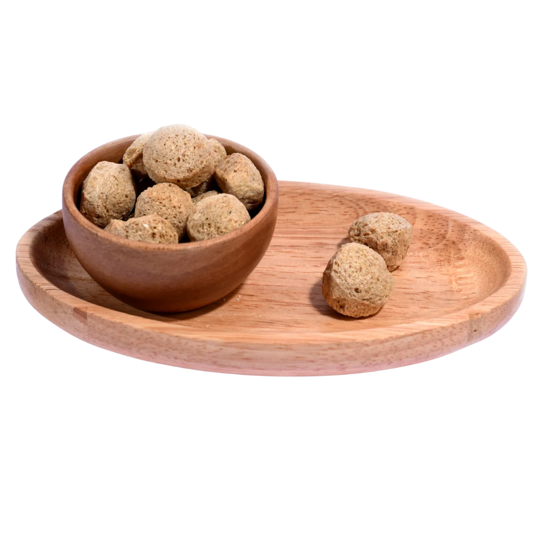 Premium quality Soya Chunks displayed in a rustic wooden bowl, perfect for healthy vegetarian meals.