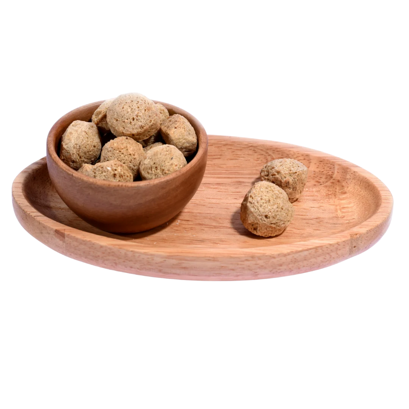 Premium quality Soya Chunks displayed in a rustic wooden bowl, perfect for healthy vegetarian meals.