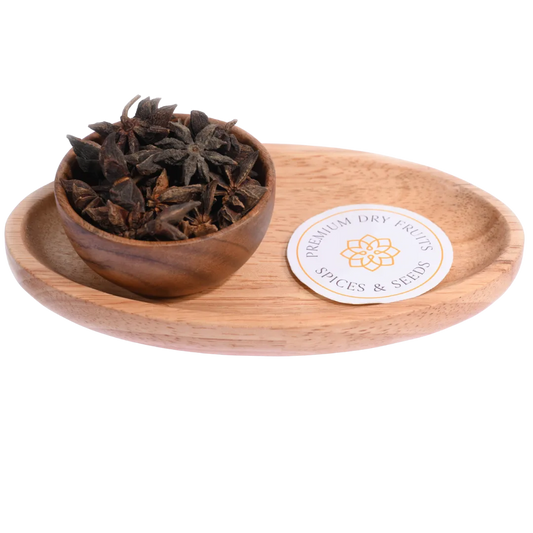 Star Anise or Chakra Phool in a wooden bowl showcases beautifully shaped aromatic spice pods.