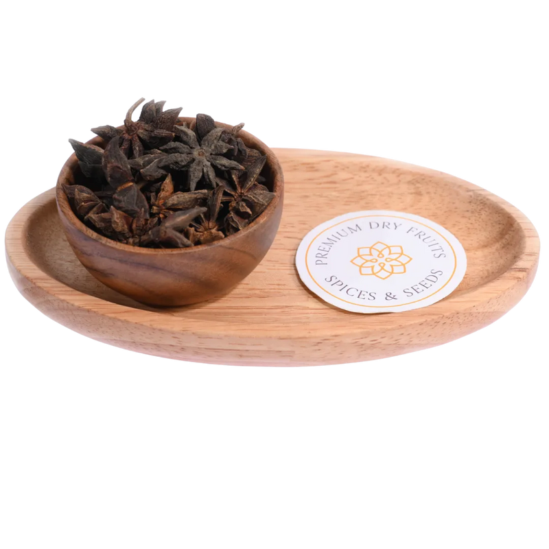 Star Anise / Chakra Phool in a wooden bowl showcases beautifully shaped aromatic spice pods.