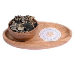 Stone Flower / Dagad Phool in a wooden bowl showcases dried, aromatic fungal spice pieces.