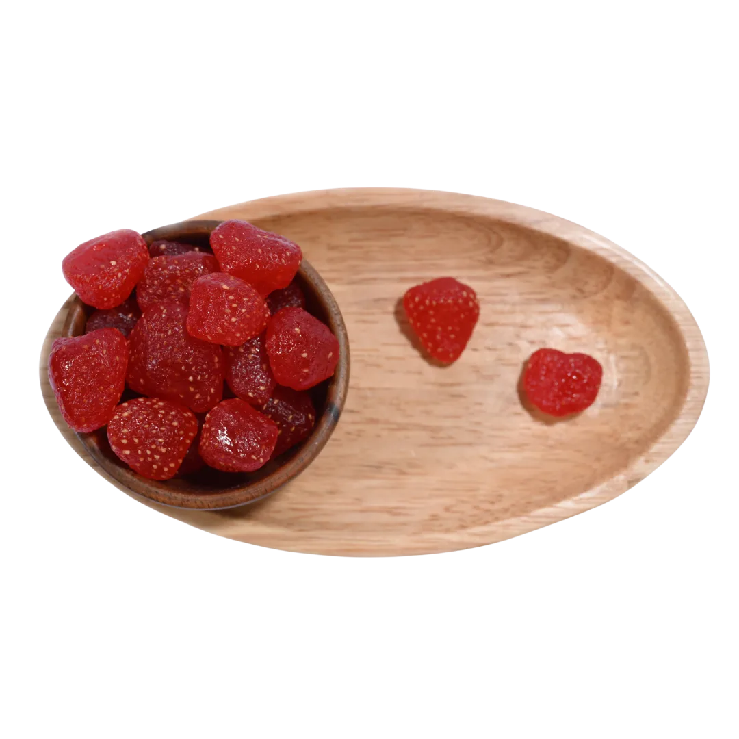 Wooden bowl and tray with red Strawberries Dried Whole Premium on a white background.