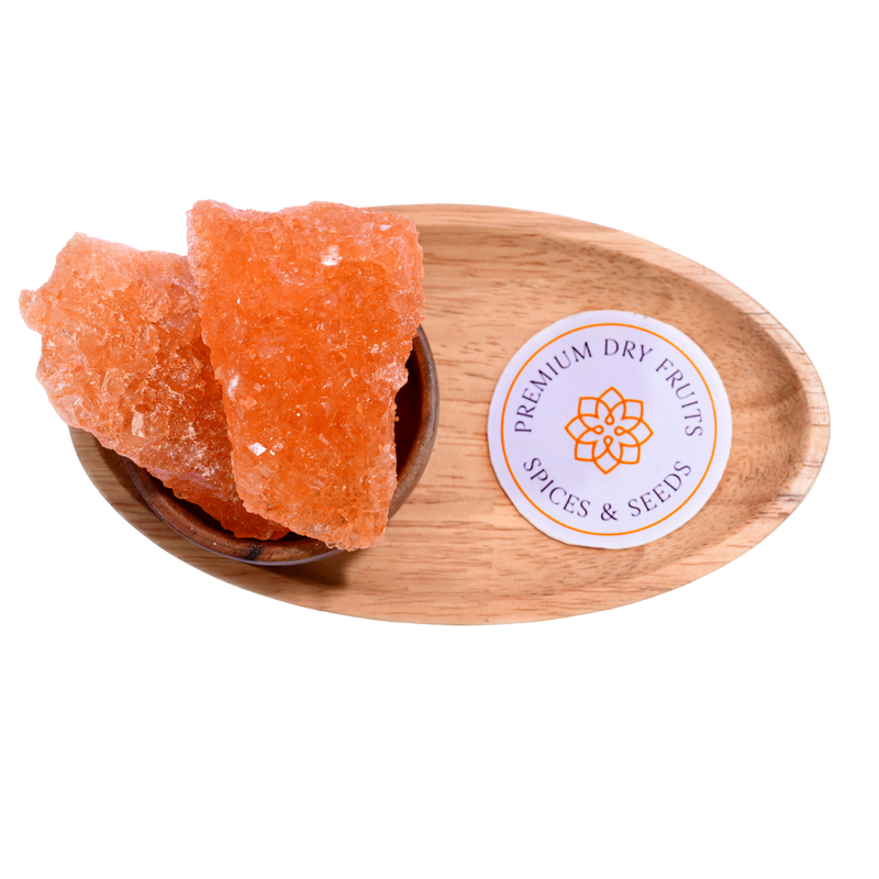 Sugar Candy saffron-infused golden crystals in a wooden bowl, aromatic and flavorful for spiritual offerings