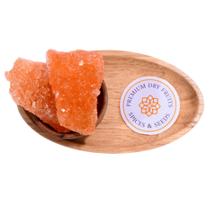 Sugar Candy saffron-infused golden crystals in a wooden bowl, aromatic and flavorful for spiritual offerings