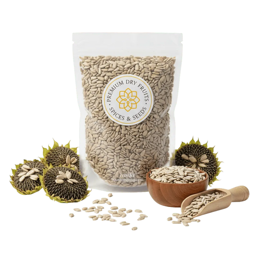 Bag of premium dry fruits with a label, surrounded by sunflower seeds and a wooden bowl.