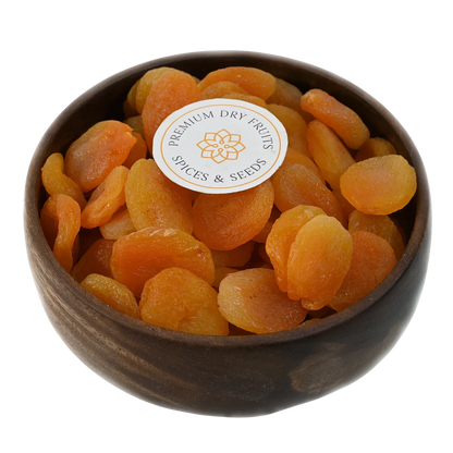Turkish Dried Apricots Seedless Premium in wooden bowl – soft golden orange apricots rich in vitamins fiber and antioxidants for healthy snacking