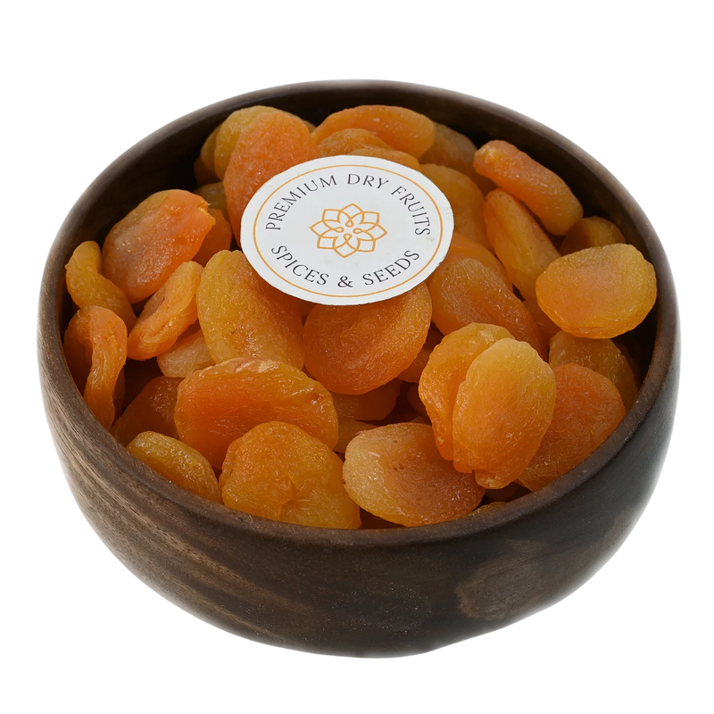 Turkish Dried Apricots Seedless Premium in wooden bowl – soft golden orange apricots rich in vitamins fiber and antioxidants for healthy snacking