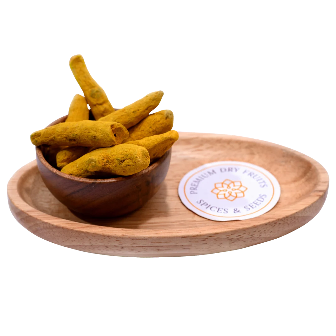 Turmeric stick or haldi gatiya in wooden bowl natural spice for cooking and health