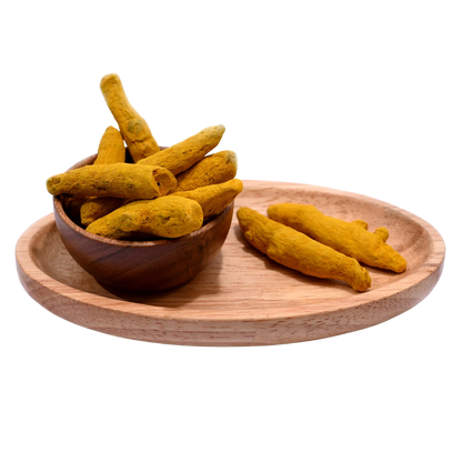 Organic turmeric stick or haldi gatiya in wooden bowl rich in curcumin and flavor