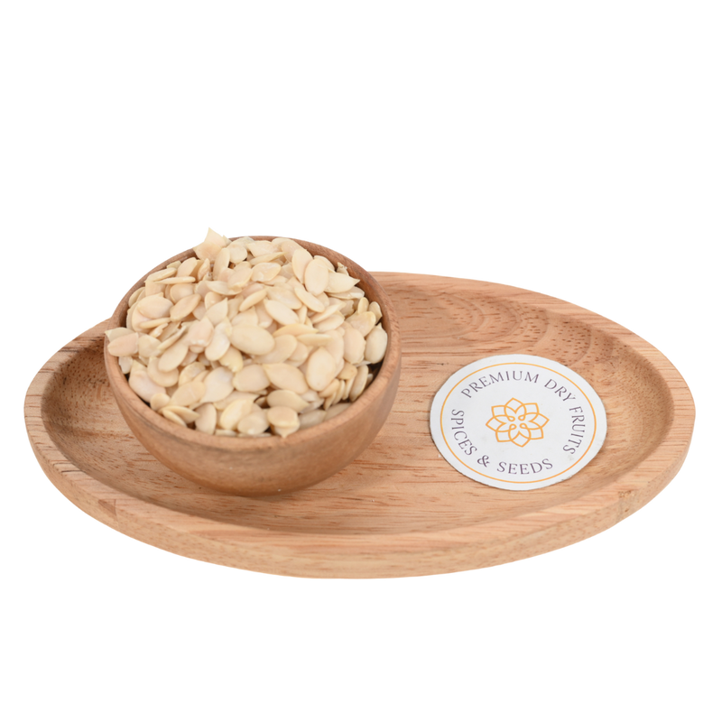 Close-up of watermelon seeds (Tarbuj Magaj) in a rustic wooden bowl on a wooden surface.
