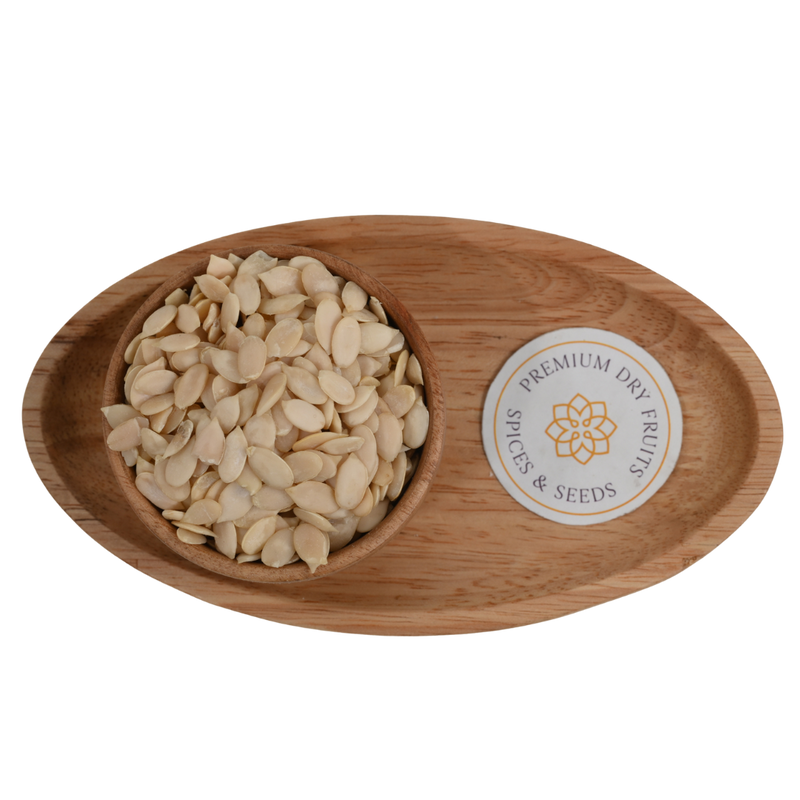 Top view of healthy watermelon seeds neatly arranged in a round wooden bowl.