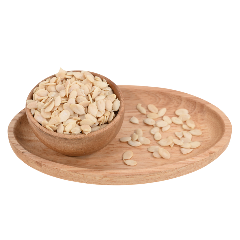 Tarbuj Magaj, or watermelon seeds, served in a natural wooden bowl, perfect for snacking.