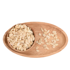 Organic watermelon seeds displayed in a handcrafted wooden bowl, ideal for healthy eating.
