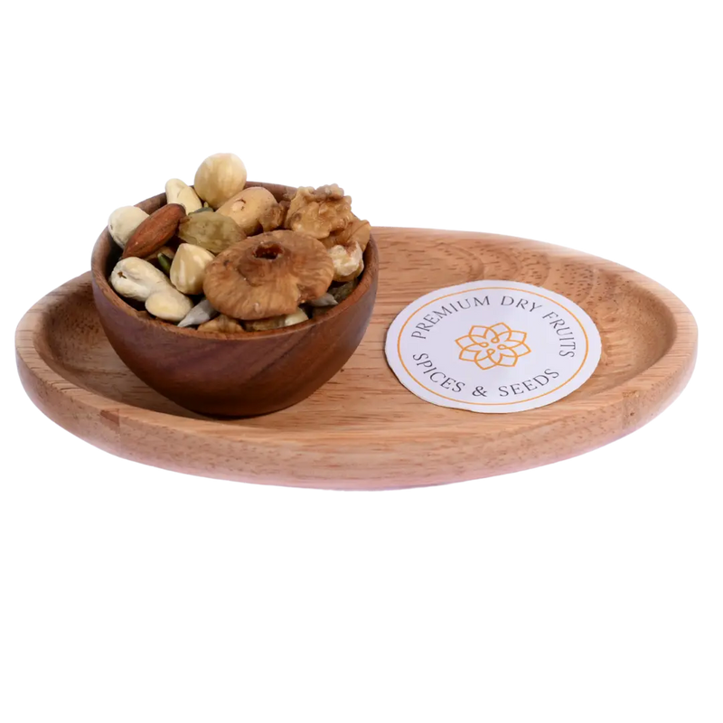 Wholesome Nutty Trail Mix in a wooden bowl displays a rich assortment of nuts and dried fruits.