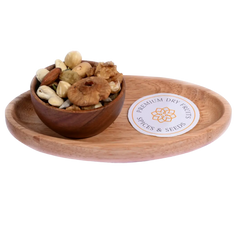 Wholesome Nutty Trail Mix in a wooden bowl displays a rich assortment of nuts and dried fruits.
