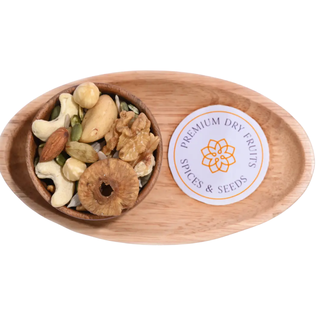 Wooden bowl with Wholesome Nutty Trail Mix assorted dry fruits and spices on a wooden tray.