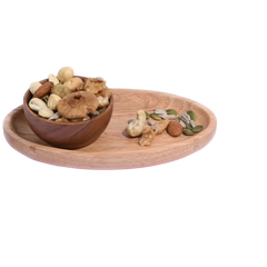 Wooden bowl and tray with mixed nuts Wholesome Nutty Trail Mix on a white background