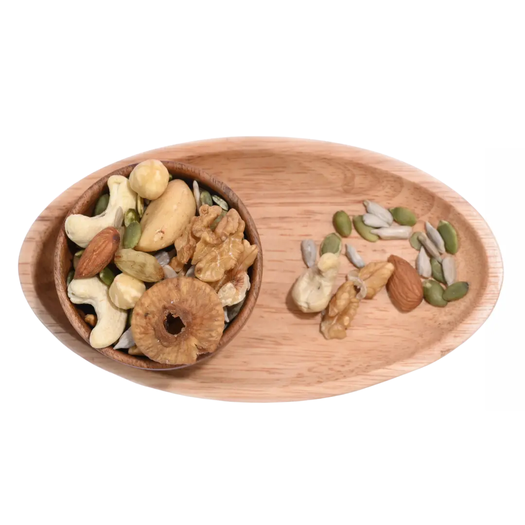 Wooden tray with Wholesome Nutty Trail Mix various nuts and seeds on a white background