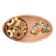 Wooden tray with Wholesome Nutty Trail Mix various nuts and seeds on a white background