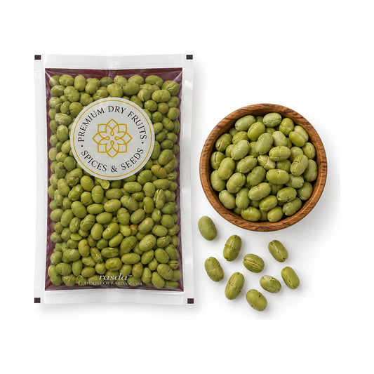 Roasted edamame in a 100g pouch with a wooden bowl of beans and a few scattered beside it