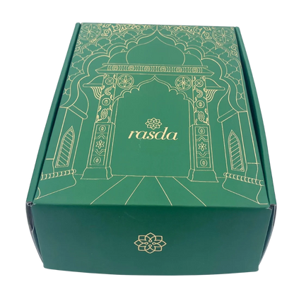 Ranvita Designer gift box closed, emerald green with gold Mughal archway line art and the rasda wordmark