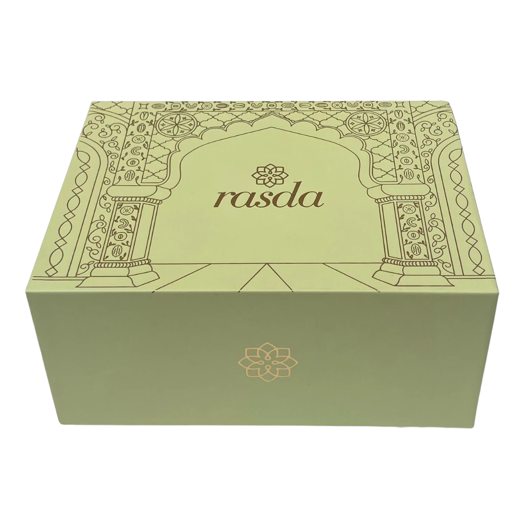 Reva Signature gift box closed, sage green rigid box with a gold-foiled arch and the rasda wordmark
