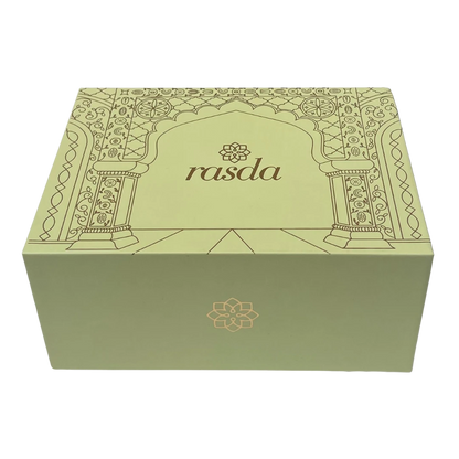 Reva Signature gift box closed, sage green rigid box with a gold-foiled arch and the rasda wordmark