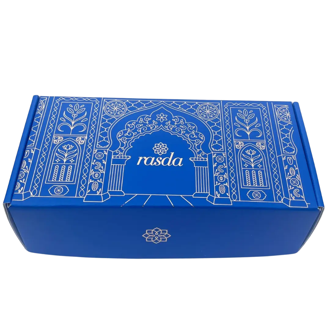 Rucira Designer gift box closed, cobalt blue with white Mughal archway line art and the rasda wordmark