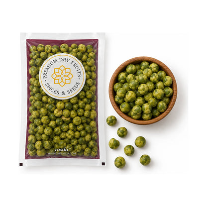 Wasabi coated green peas in a 100g pouch with a wooden bowl of peas and a few scattered beside it