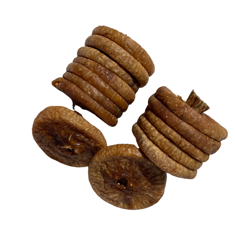 A close-up photo of dry figs and anjeer, commonly known as figs, displayed elegantly in a group.
