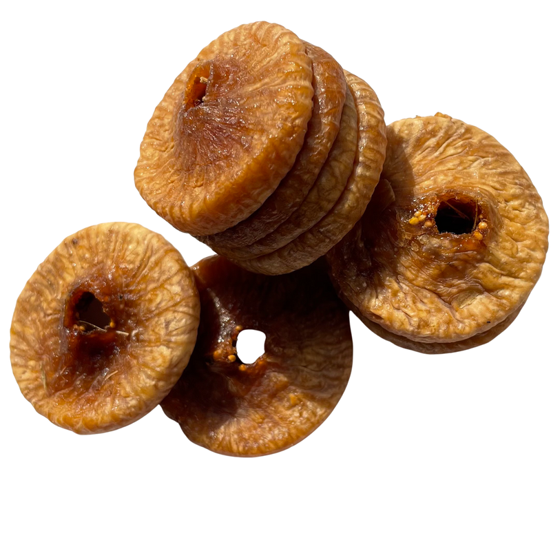 Picture of dry figs and anjeer, also called figs, neatly placed together on a plain backdrop. 
