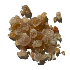 Gaundh or Gum or Gond it is shiny Crystals and melts in water.